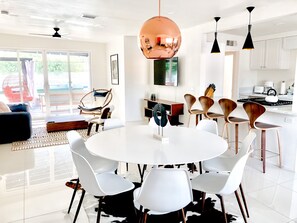 Main dining and living area with classic midcentury pieces