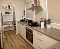 Fully equipped kitchen with walk in pantry 