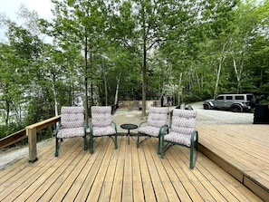 Upper deck, fire pit (with globe lights) and parking area. 