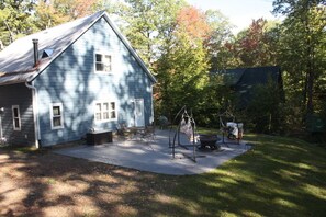 LARGE PATIO WITH PLENTY OF SEATING, FIRE PIT and CHARCOAL GRILL 