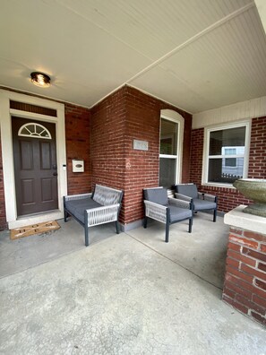 Very large front porch with privately fenced front yard