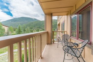 Private balcony offering outdoor seating and incredible mountain views.