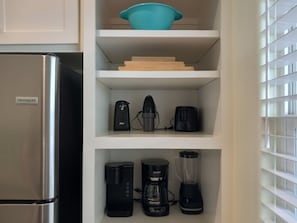 Blender, toaster, mixer, drip coffee pot, and cutting boards