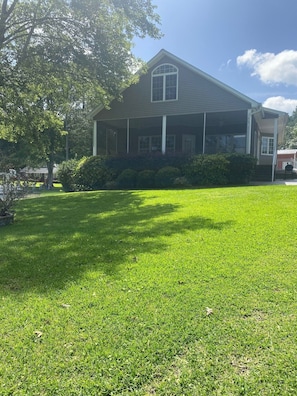 View of the home from the water. Great space for children to enjoy outside play.