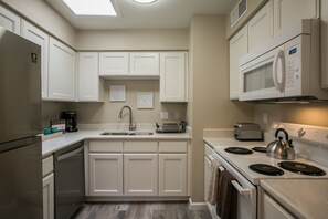 Freshly remodeled kitchen with quartz counters and new modern appliances