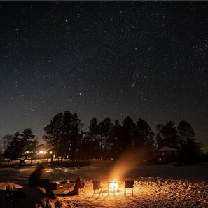 Bonfire on the frozen lake. Great star gazing 