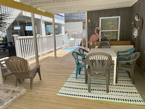 Private covered porch with outside dining and grilling area