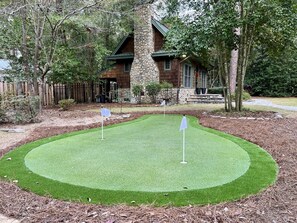 Bring your clubs and balls and enjoy the backyard putting green.