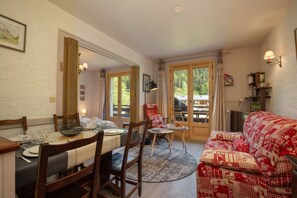 Cosy lounge and dining area with access to the balcony