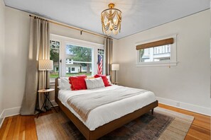 Luxury and comfort converge in Bedroom #1, featuring a plush king-sized bed and serene views.