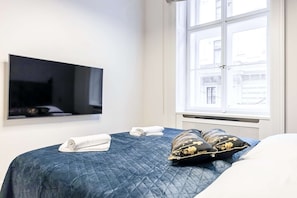 Bedroom with king-size bed and smart TV