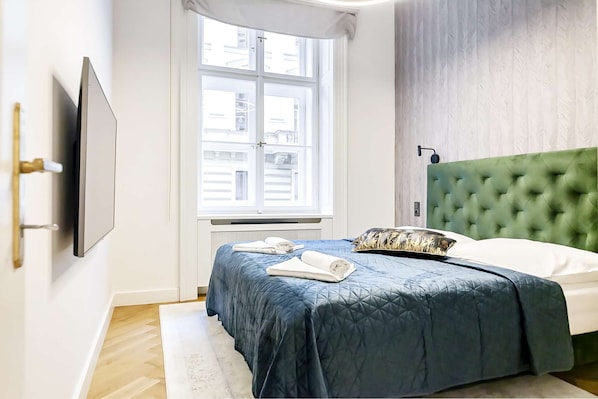 Bedroom with king-size bed and smart TV