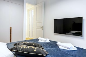 Bedroom with king-size bed and smart TV