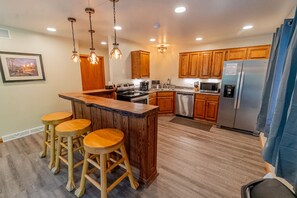 Kitchen - Main Level. Kitchen bar with bar-stools.