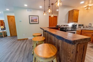 Kitchen - Main Level. Kitchen bar with bar-stools.