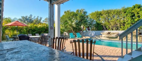 Sit at the tiki bar and enjoy your pool!