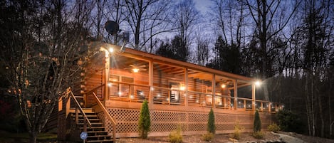 Front of cabin at night
