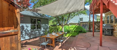 Backyard terrace with outdoor dining & sunshade