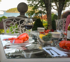 Lobsters on the deck with an ocean view.