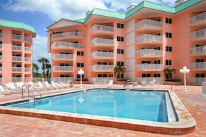 Come on in, the Water’s Fine - Cool off in the heated pool at Beach Cottage Resort and then dry off in the sun on a poolside lounge chair.