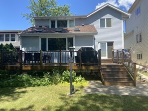 Back of house with deck/grill/patio table