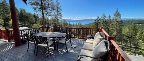 Front deck with views of Flathead Lake. Plenty of places for guest to sit and enjoy sights.