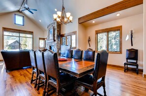 The dining table is elegant and features classic wood craftsmanship.