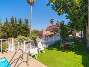 Sky, Plant, Building, Shade, Tree, Outdoor Furniture, Land Lot, House, Grass, Cottage