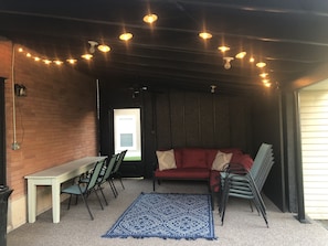 Back patio with a sectional couch, long table and 8 extra chairs.  Enjoy it!