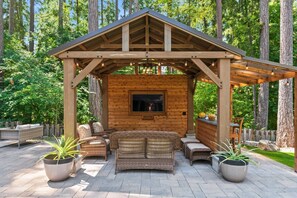 The outdoor gazebo with power and TV for streaming is perfect for entertaining.