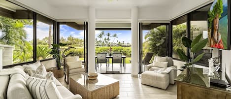 Living Room with Sofas, Smart TV, and Ceiling Fan