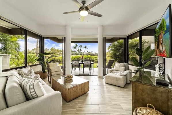 Living Room with Sofas, Smart TV, and Ceiling Fan