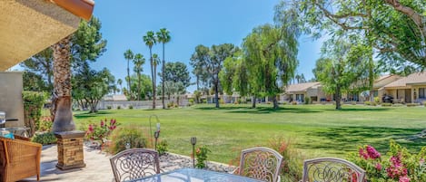 Enjoy the spacious back patio with Pool views.