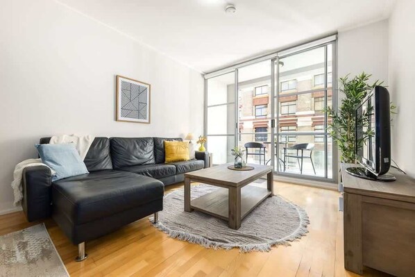 A living area with a 3-seater couch.