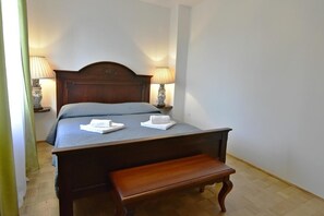 Bedroom 2 on the first floor with double bed and two night lamps