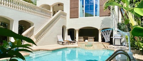 Relax under the palm trees, or play in the sun, in your private courtyard pool.