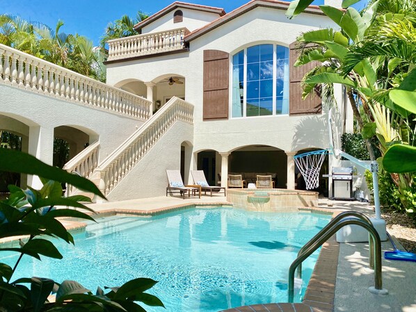 Relax under the palm trees, or play in the sun, in your private courtyard pool.