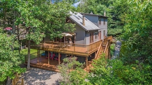 Three level home with wrap around deck and lake views!