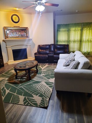 Living room with upgraded wood flooring 