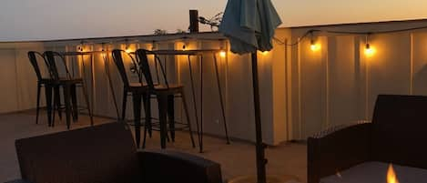 rooftop deck fire pit and sunset