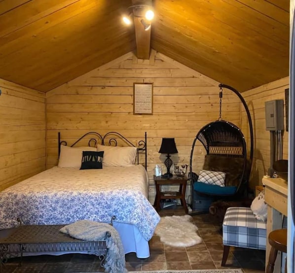 Cozy one-room cabin with luxurious queen size memory-foam mattress. 