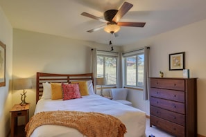 Cozy secondary queen bedroom with luxury linens