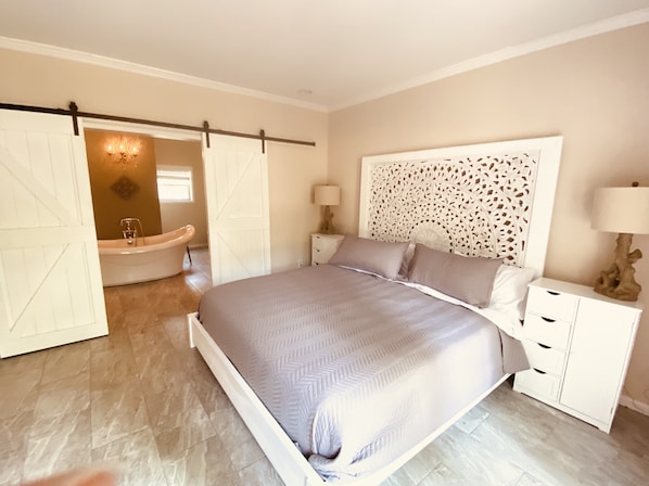 King bed Soaking tub, shower, his & her vanities french door to deck