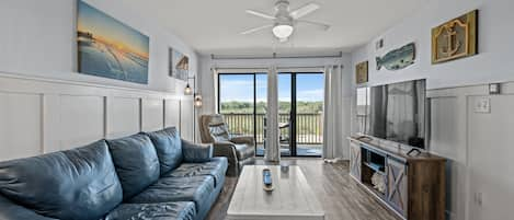 The ocean front living room is well-appointed with comfortable furnishings.