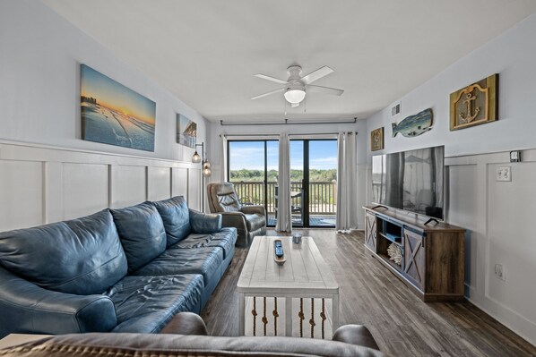 The ocean front living room is well-appointed with comfortable furnishings.