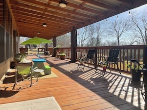 Enjoy our large covered elevated deck overlooking the fenced back yard. 