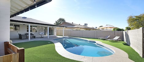 Comfortable patio and backyard with sparkling pool (newly resurfaced Nov 2020!). Enjoy the sun on the lounge chairs or relax in the addictive egg chair!