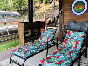 Lounge Chairs under covered dock - enjoy wide water and mountain views.