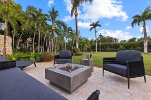 Firepit located in the newly added seating area between the pool and lawn