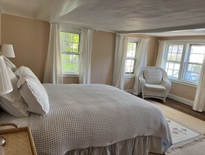 sunny guest bedroom with Queen bed